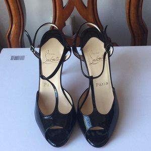 Womens black patent leather t-strap heel by Christian Louboutin